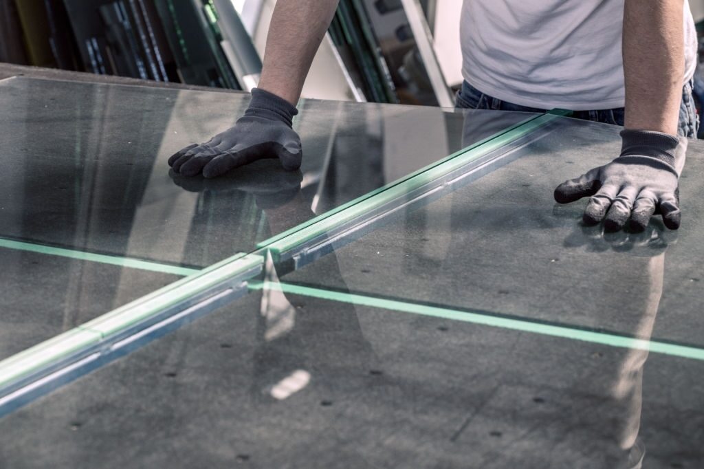 A Worker Cuts Glass In A Glass Workshop